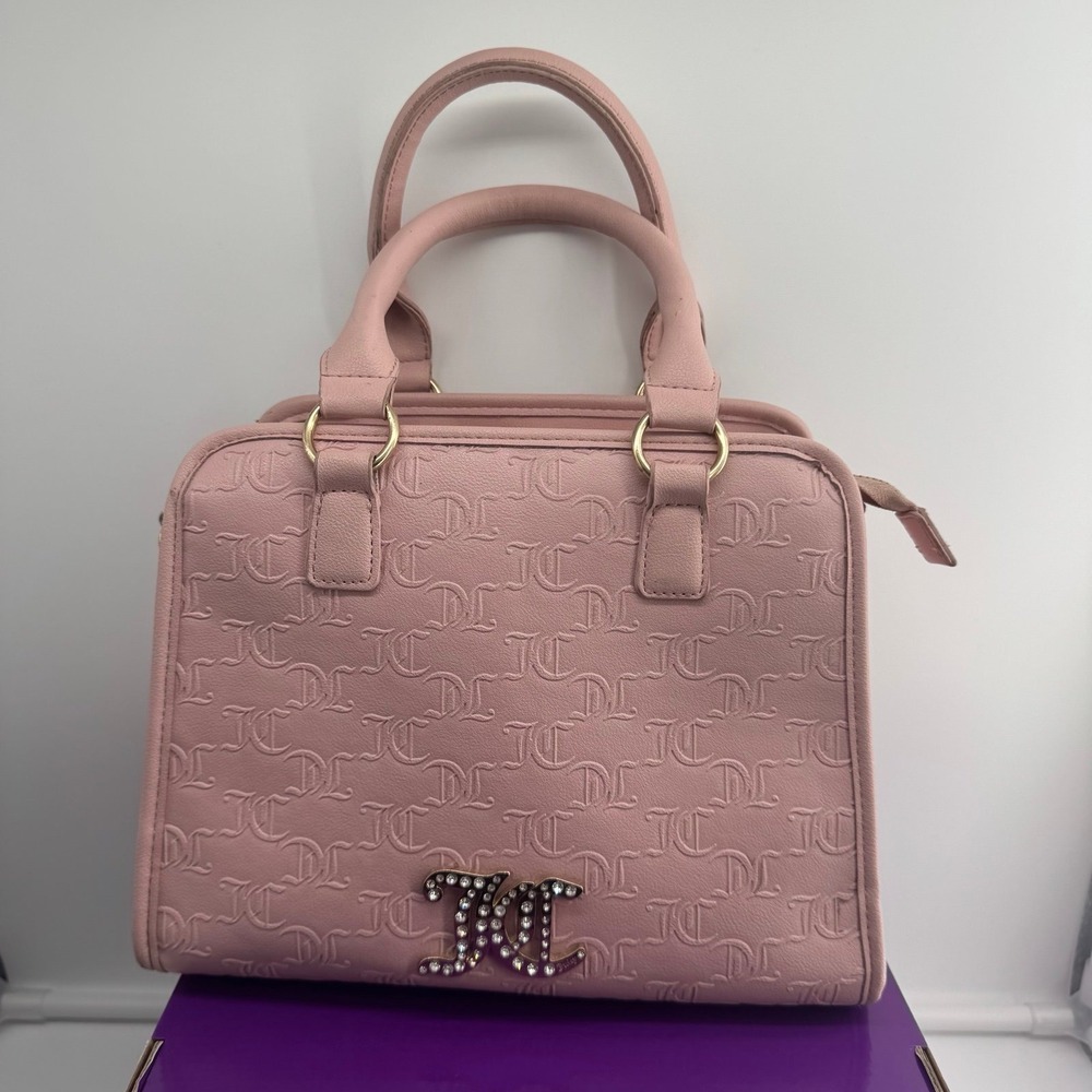 Y2K Juicy Couture satchel in pink, features an all-over embossed "JC" monogram